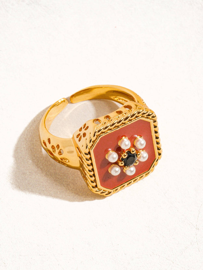 close up view of Vintage red enamel ring with 18K gold plating.